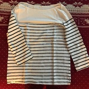 A boat neck sequined 3/4 sleeved shirt